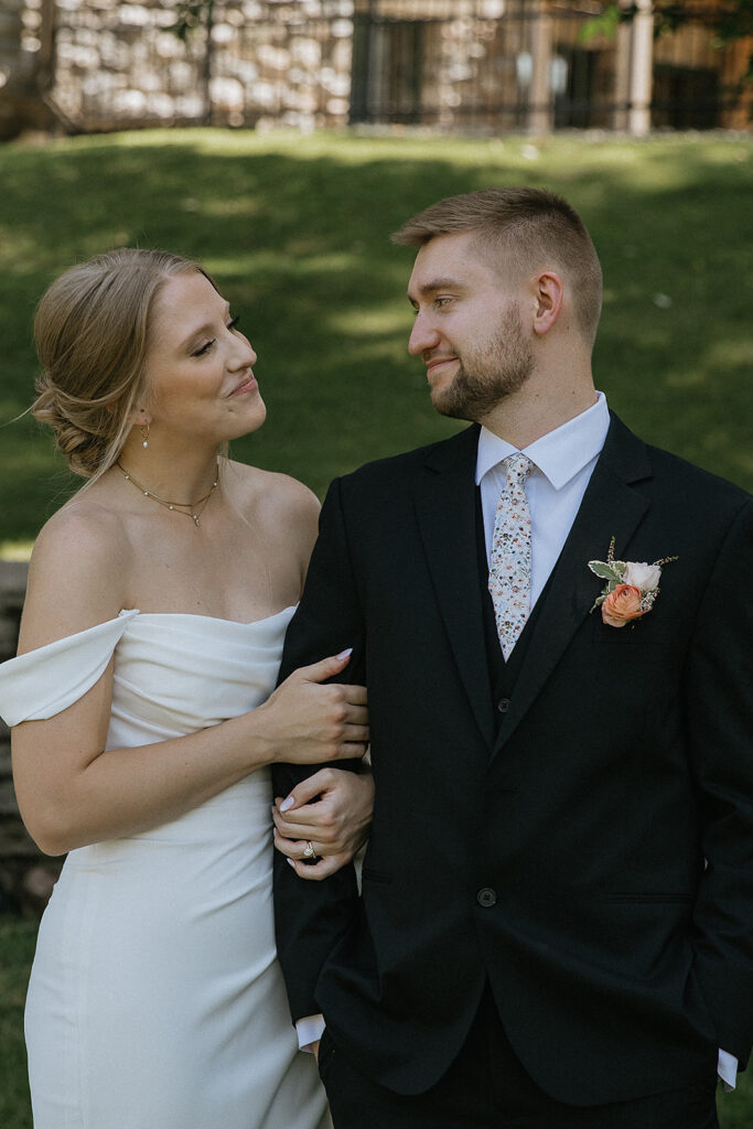 Picture of the bride and groom, smiling at each other
