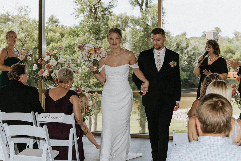 couple heading to their wedding reception