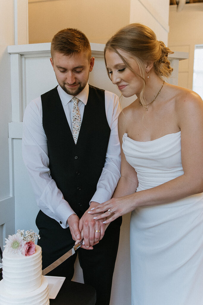 couple cutting their wedding cake