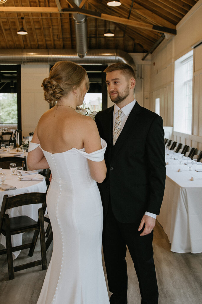 groom emotional seeing the bride in her wedding dress