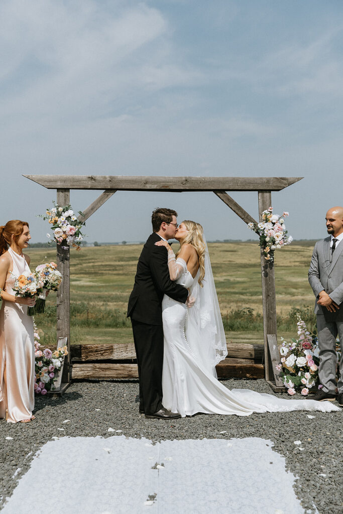 Couple kissing after their ceremony