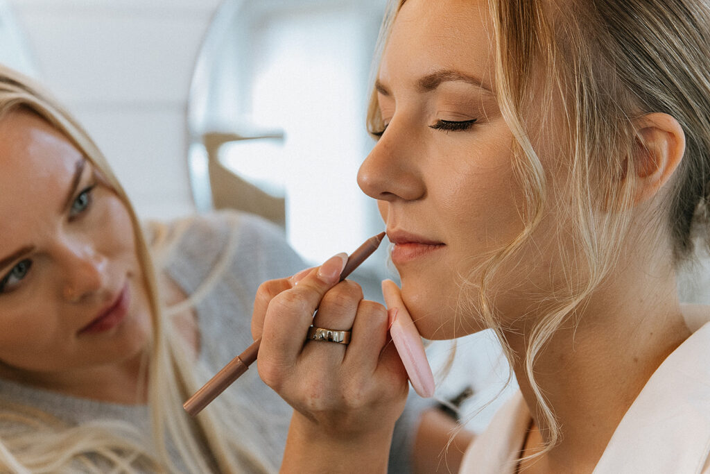 Bride getting her makeup done for her dream wedding