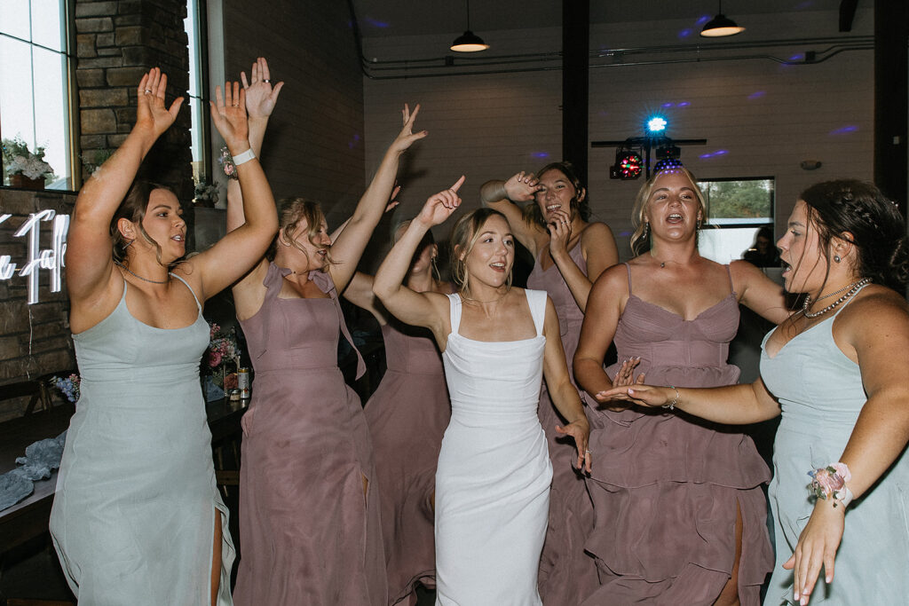 Bride and her friends dancing at the reception party