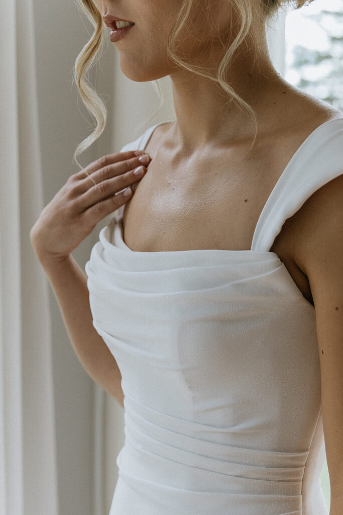 Stunning close-up shot of the bride wedding dress