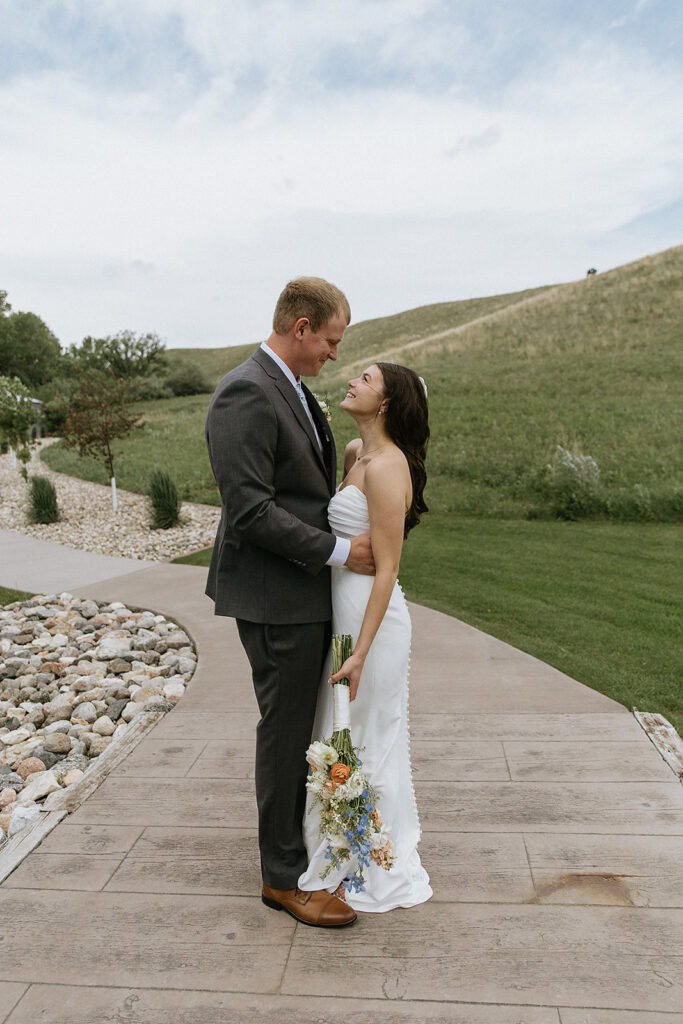Cute picture of the bride and groom, smiling at each other