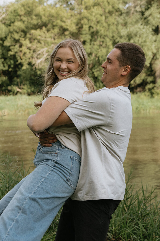 Cute couple playing during their engagement session
