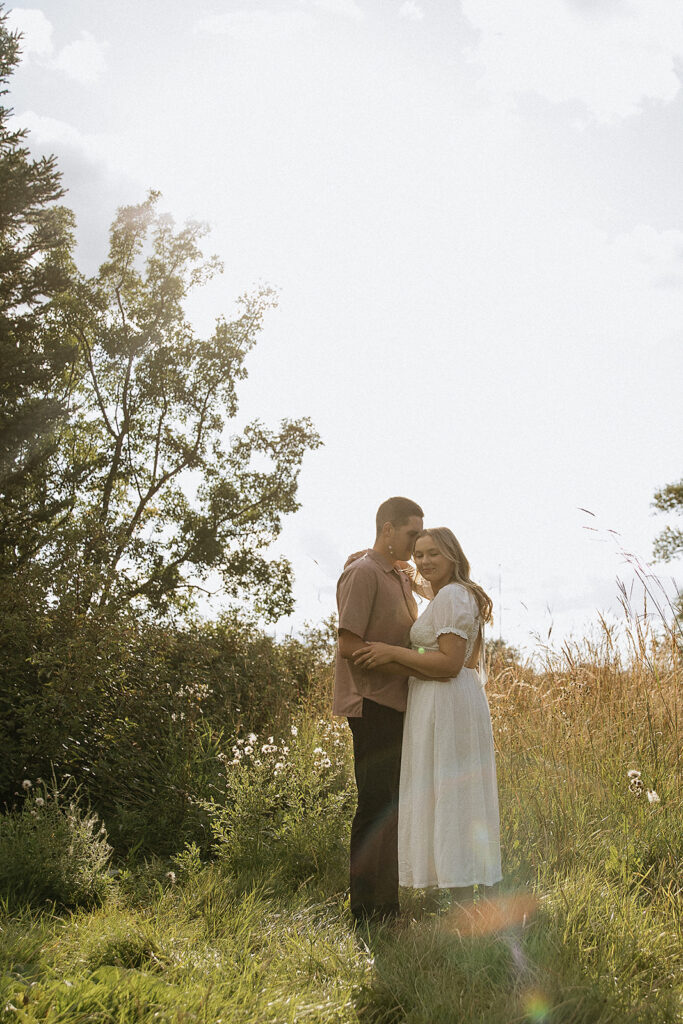 Fiancé, kissing his fiancé on the forehead