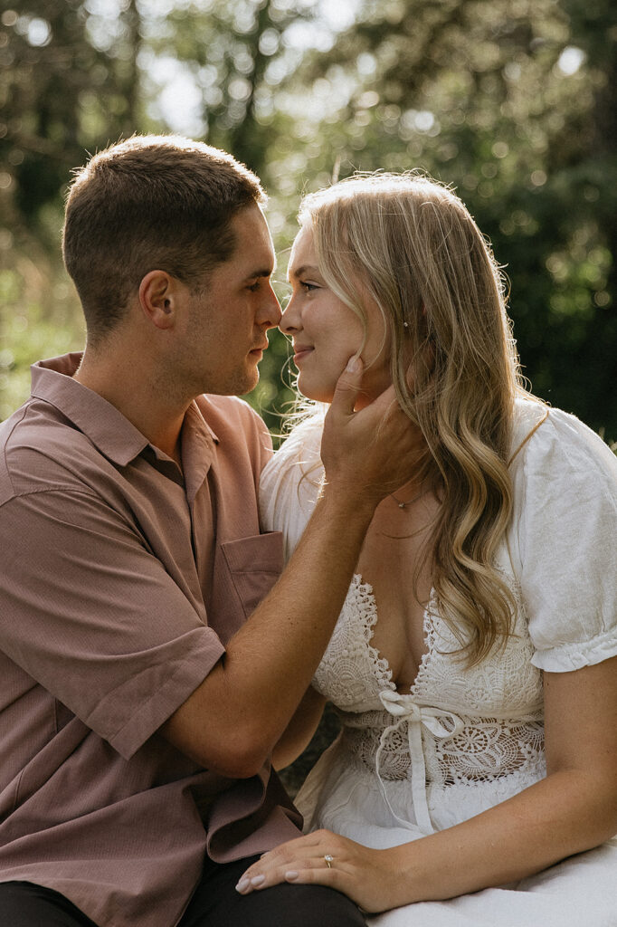Cute picture of the newly engaged, couple kissing