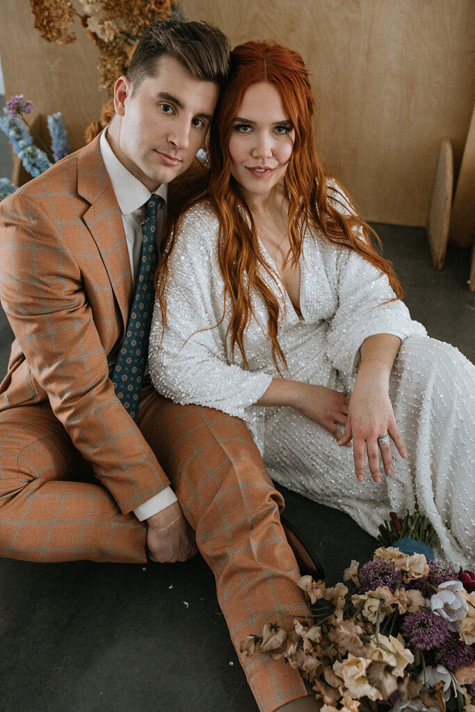 picture of the newlyweds smiling at each other during their photoshoot