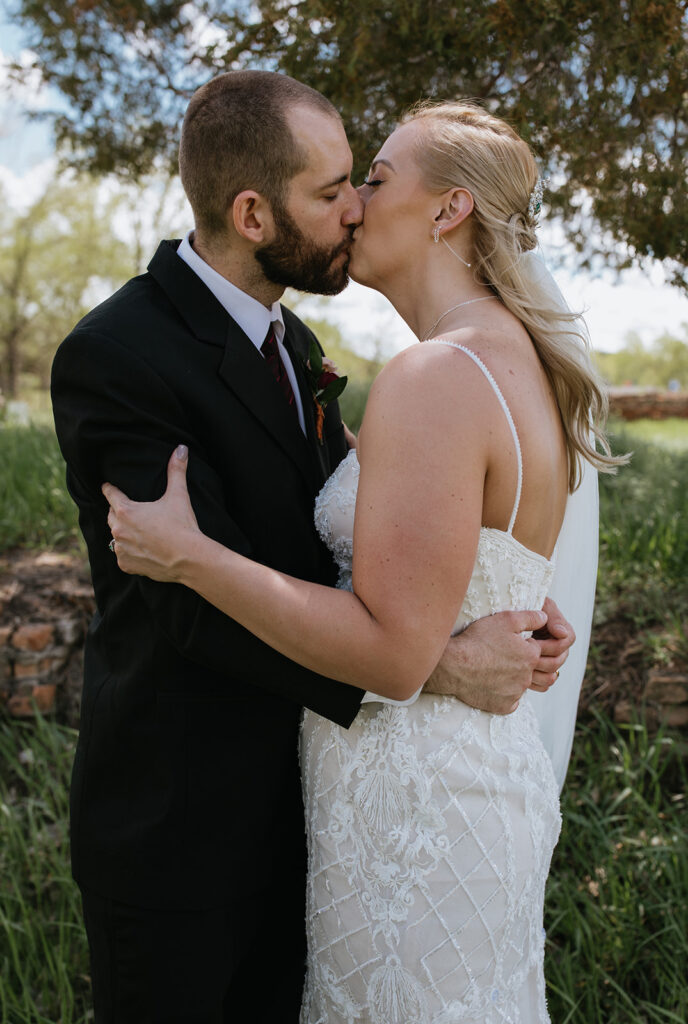cute picture of the bride and groom kissing 