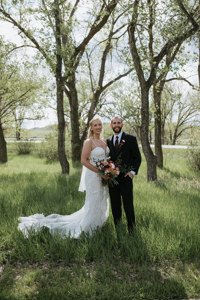 couple smiling at the camera during their photoshoot