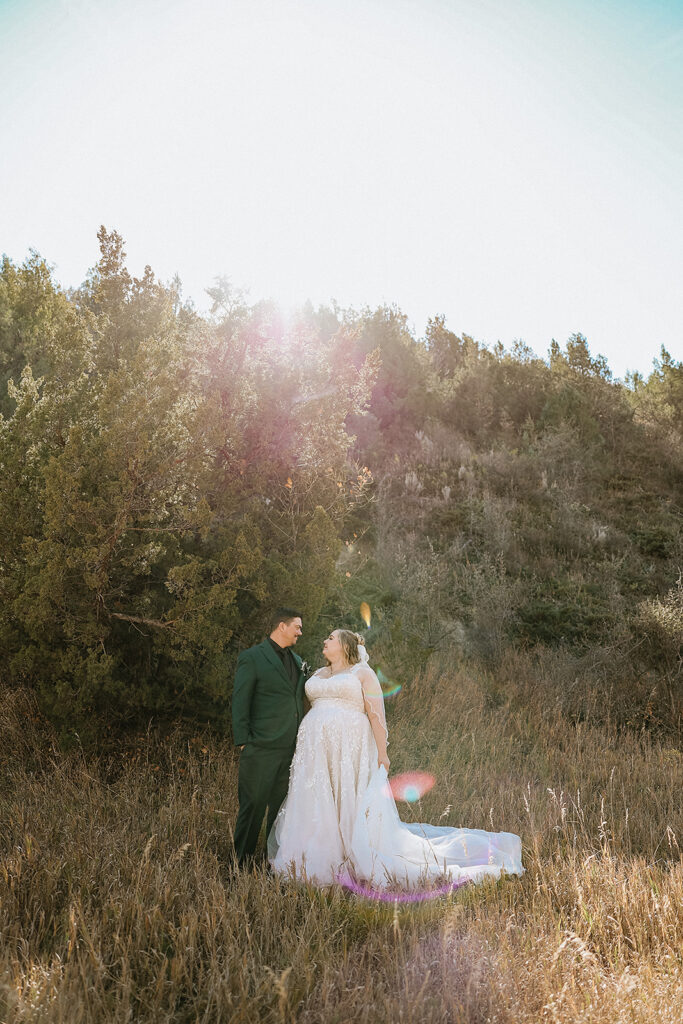 picture of the newlyweds smiling at each other 