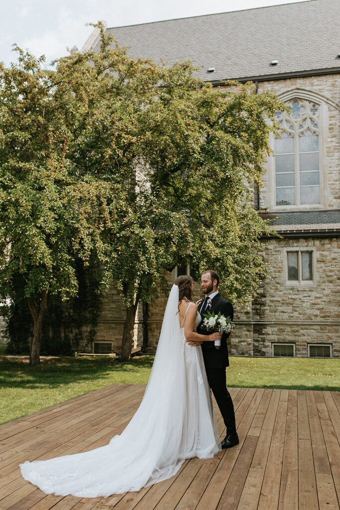 portrait of the bride and groom hugging