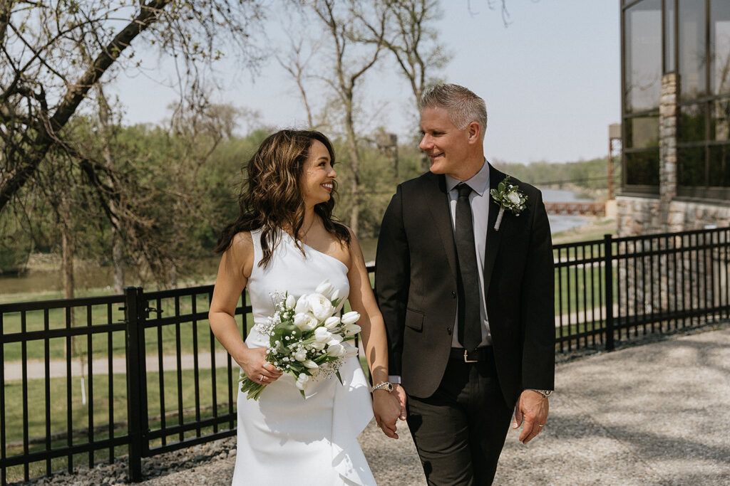stunning picture of the newlyweds laughing with each other