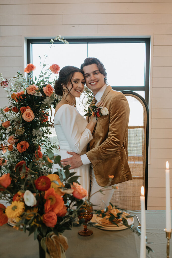 couple smiling at the camera during their bridal session