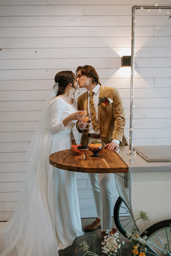 cute picture of the bride and groom kissing