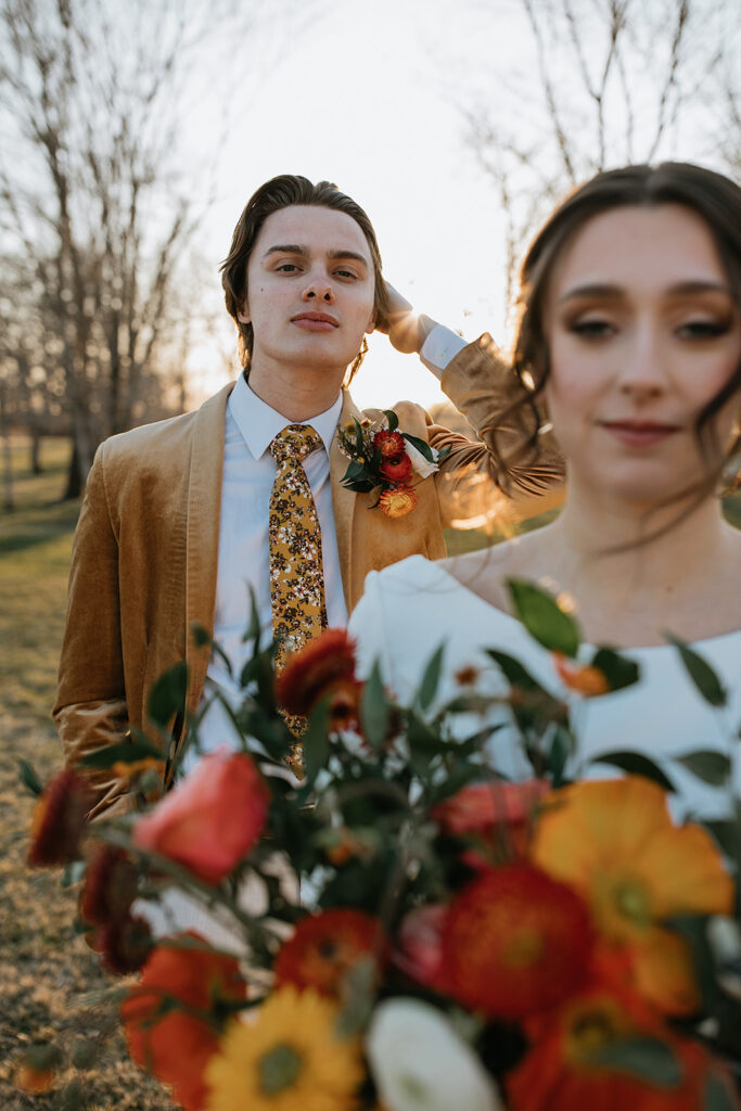 couple smiling at the camera during their bridal photos