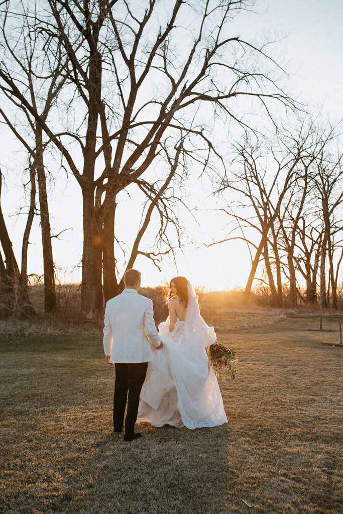 stunning picture of the bride and groom during golden hour