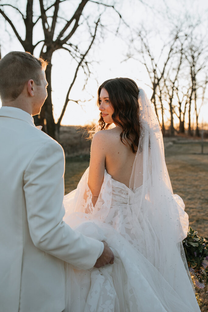 portrait of the bride and groom laughing with each other