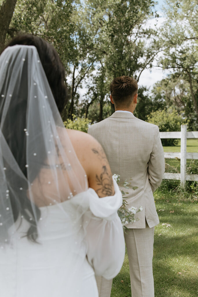 bride and groom at their first look