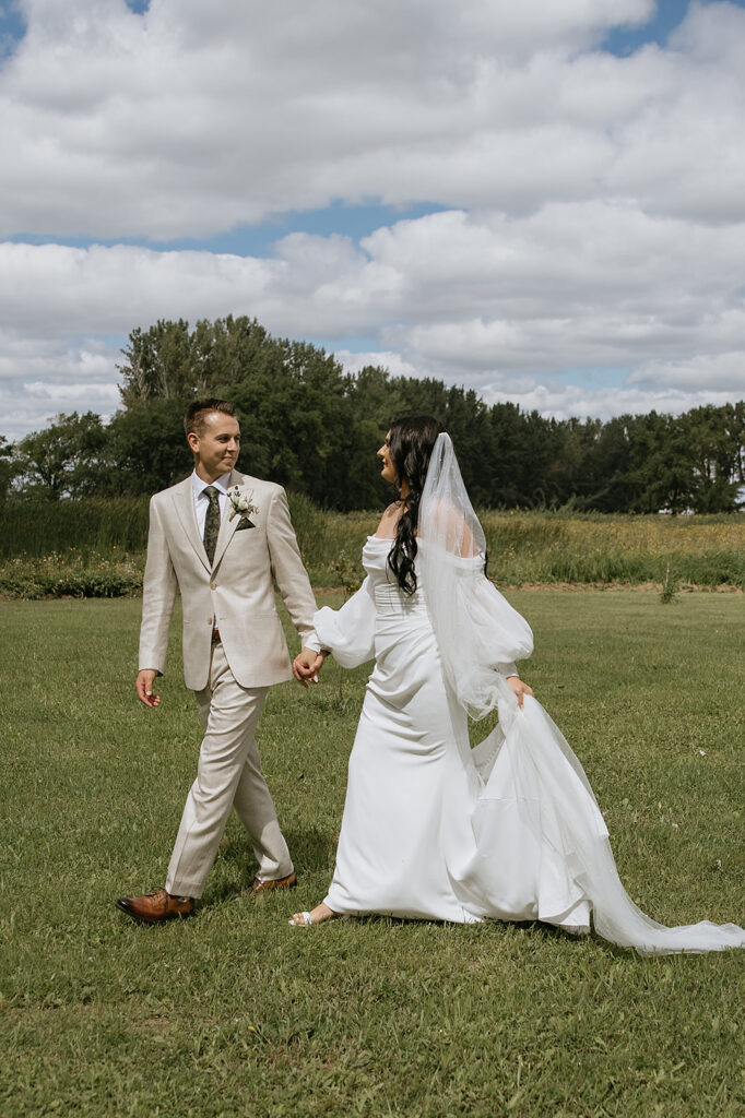 portrait of the newlyweds holding hands