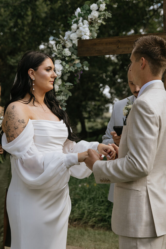 bride and groom holding hands at their ceremony
