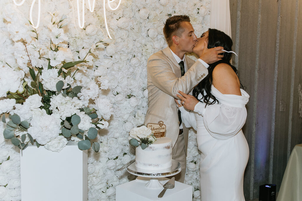 newlyweds cutting their wedding cake