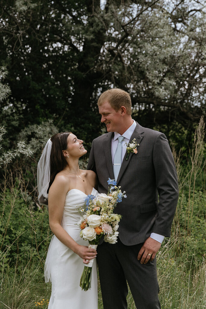 cute picture of the bride and groom smiling at each other
