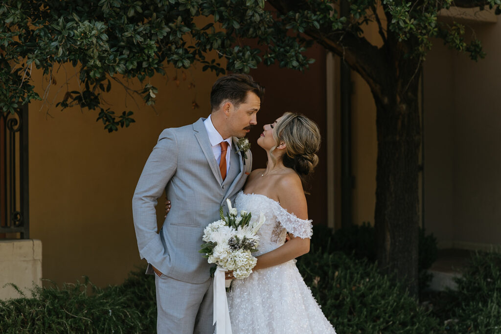 cute picture of the bride and groom smiling at each other
