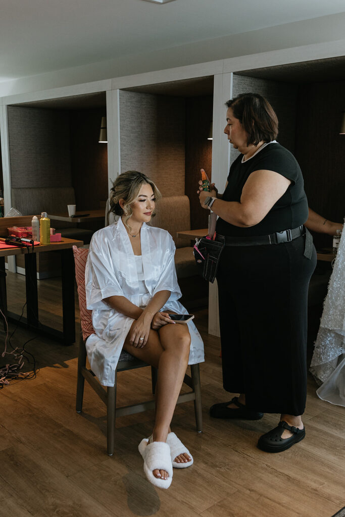 stunning picture of the bride getting her makeup done