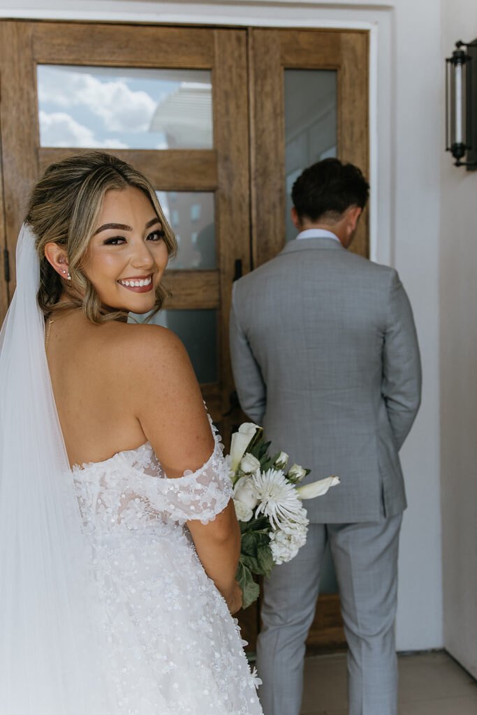 cute picture of the bride and groom at their first look