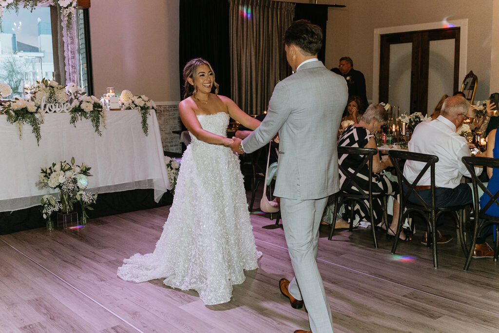 bride and groom dancing at their wedding reception