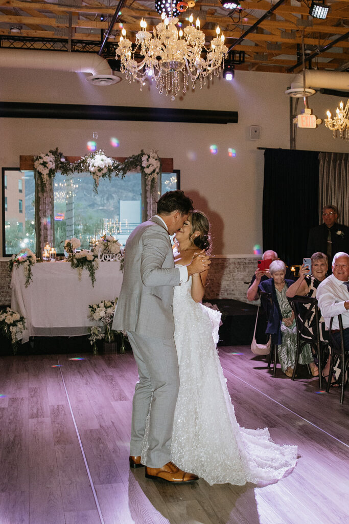 portrait of the newlyweds kissing