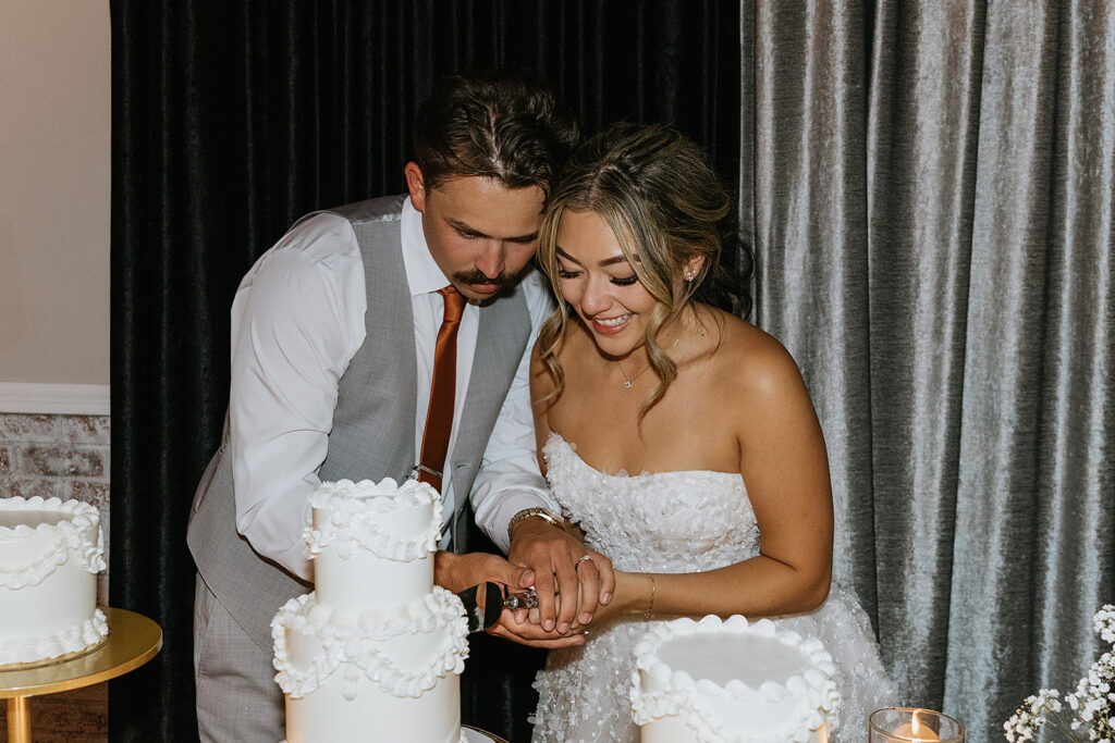 picture of the bride and groom cutting their wedding cake