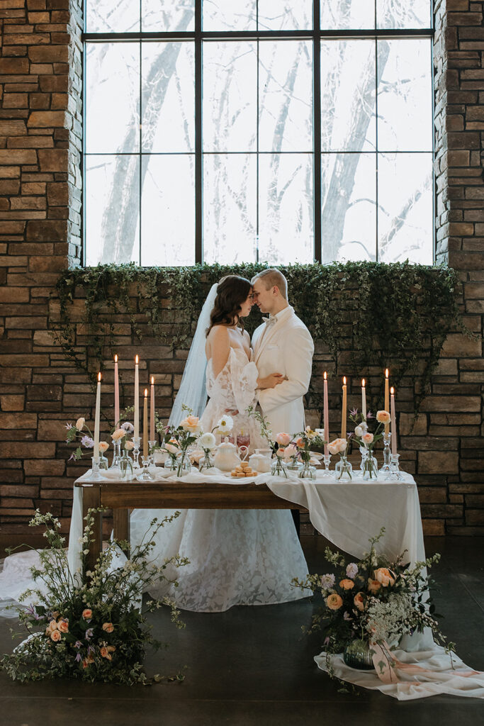 groom kissing the bride on the forehead